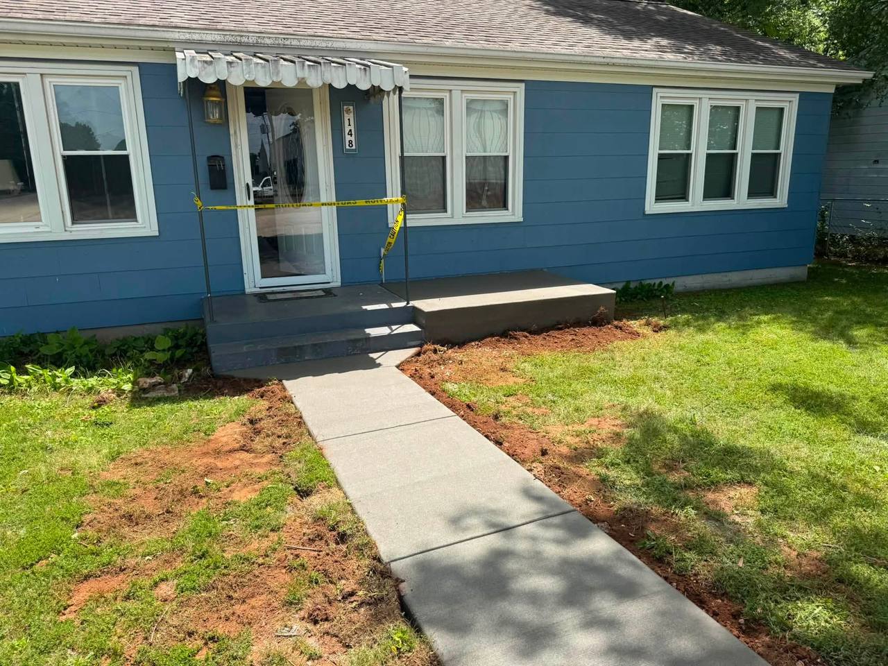 New concrete front walk, porch slab and steps at the same blue house
