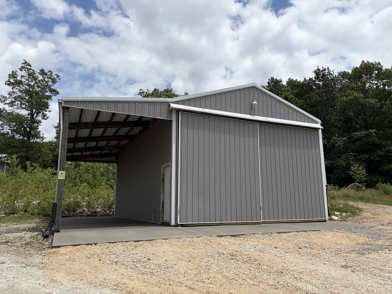 Metal pole barn with a new concrete slab and covered apron